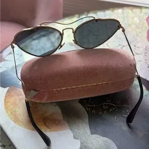 Miu Miu Elegant Gold Frame Sunglasses with Black Lenses, used in great condition Miu Miu 0MU54ZS Oval Sunglasses - Elegant & Trendy – VISIONMOOD main image 3